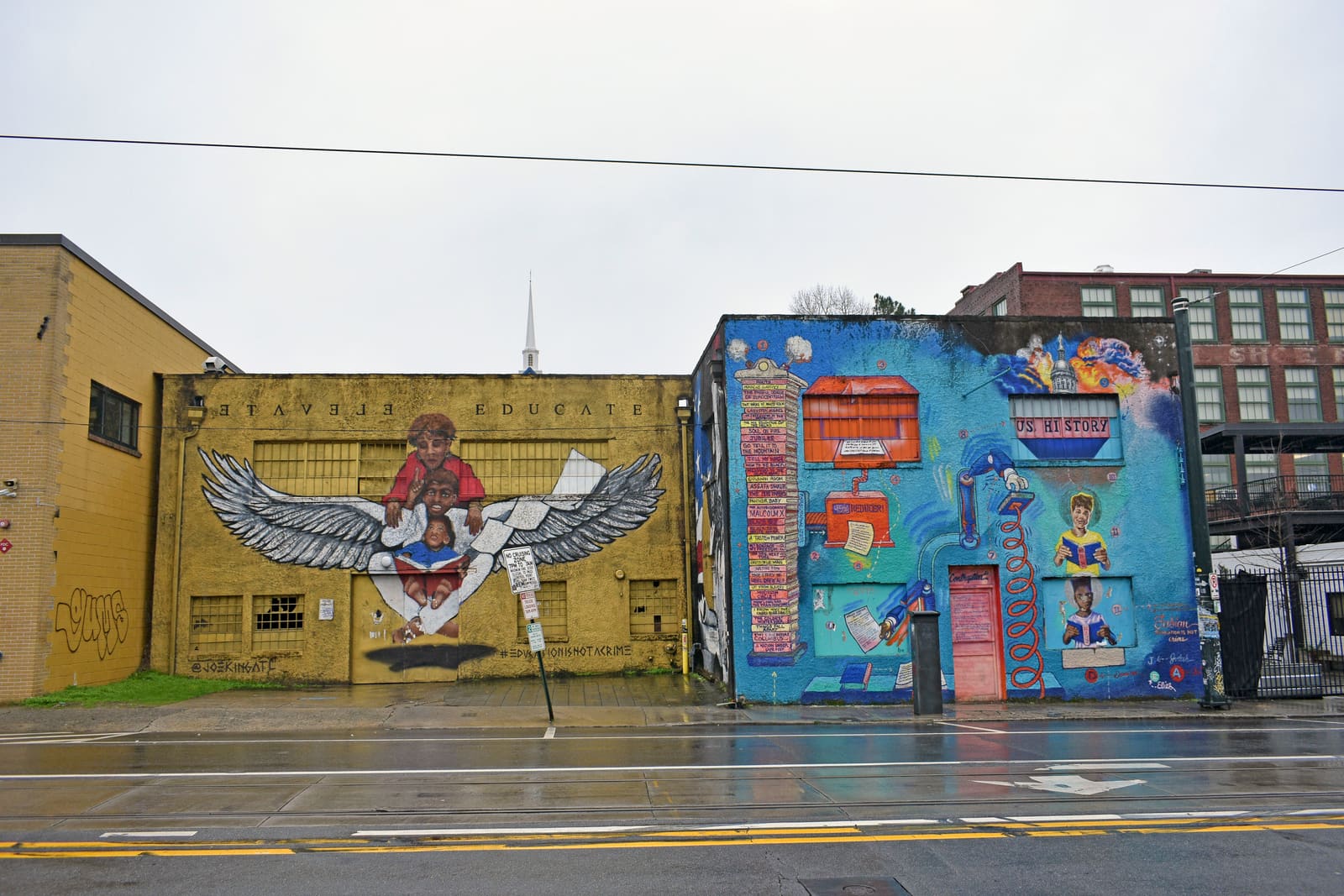 The building at 395 Edgewood Avenue in 2019, exterior painted with murals, before renovation.